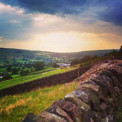 Scenic view of landscape against cloudy sky