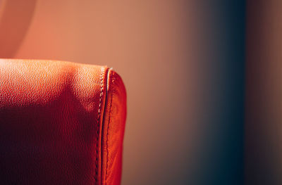 Cropped image of orange sofa