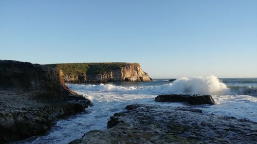 Scenic view of sea against clear blue sky