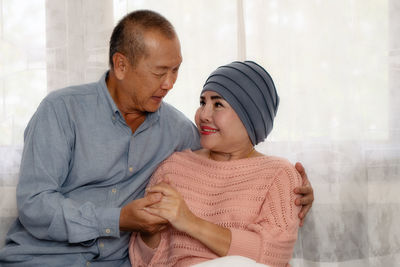 Father and daughter with baby at home