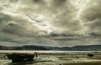 Scenic view of sea against cloudy sky