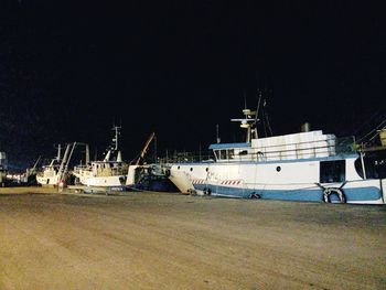 Boats moored at harbor