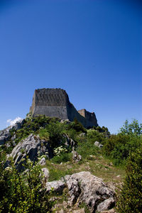 Low angle view of castle against blue sky