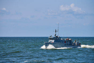 Coastguard, rescue and support patrol boat for defense sailing in blue sea. navy patrol vessel