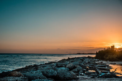 Scenic view of sea against sky during sunset