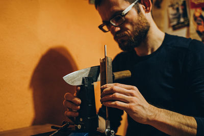 Man preparing machine in workshop