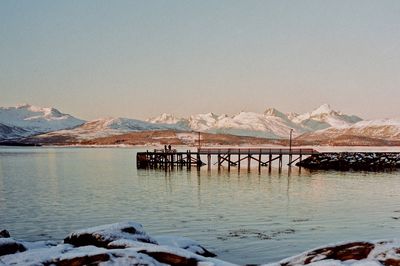 Scenic view of snowcapped mountains against clear sky