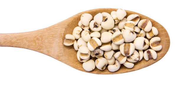 High angle view of bread in plate against white background