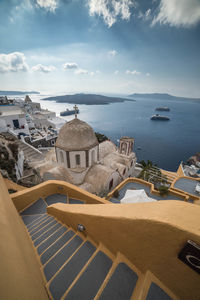 High angle view of buildings against cloudy sky