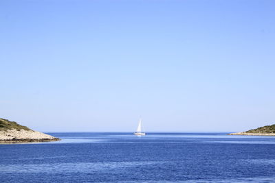 Scenic view of sea against clear blue sky