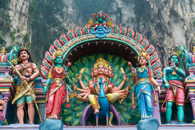 Low angle view of statues at batu caves