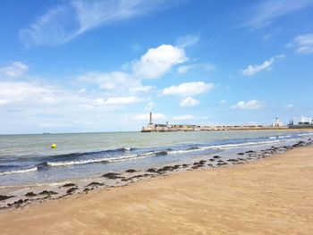 Scenic view of beach against sky