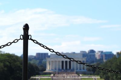 Close-up of metal against sky