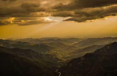 Scenic view of mountains against sky during sunset