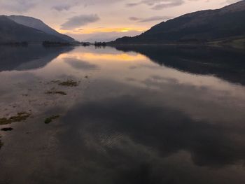 Scenic view of lake against sky during sunset