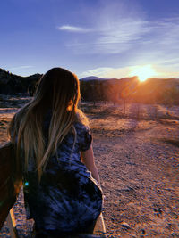 Side view of woman at beach during sunset