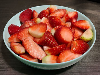 High angle view of strawberries in bowl on table