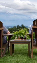 Rear view of people relaxing outdoors