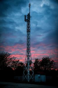 Low angle view of silhouette tower against sky during sunset