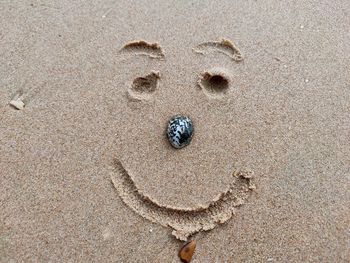 High angle view of footprints on sand