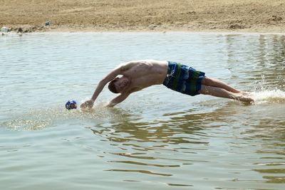 Man diving in lake