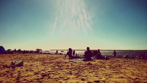 Silhouette of people on beach