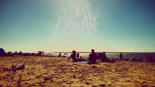 Silhouette of people on beach