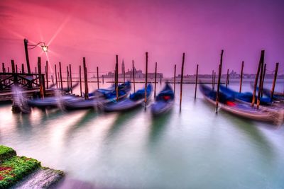 Boats moored in sea