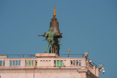 Low angle view of statue against clear sky