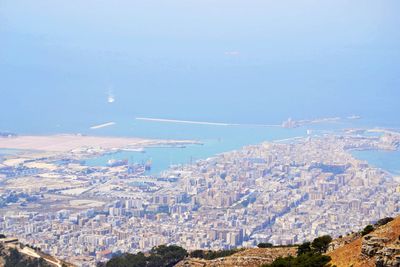 Aerial view of cityscape against sky