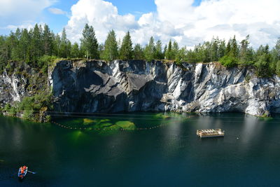 Scenic view of lake against rock formation