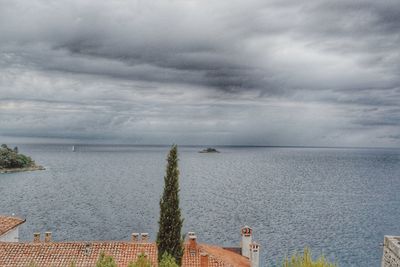 Scenic view of sea against cloudy sky