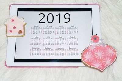 Close-up of information sign on table