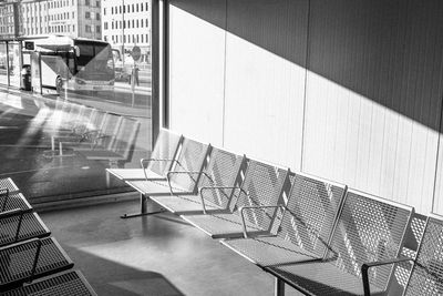 Empty chairs against building