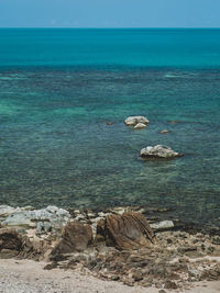 Scenic view of crystal clear turquoise  sea water at rocky bay in summer. koh samui, thailand.