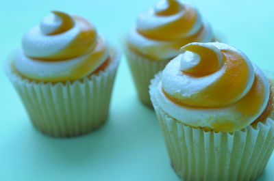 Close-up of mango cupcakes on table