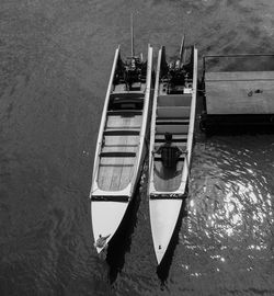 High angle view of sailboats moored in sea