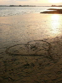 Scenic view of beach at sunset