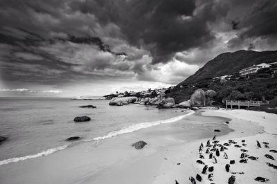 Scenic view of sea against cloudy sky