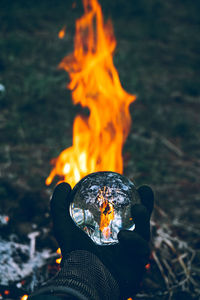 Close-up of hand holding bonfire