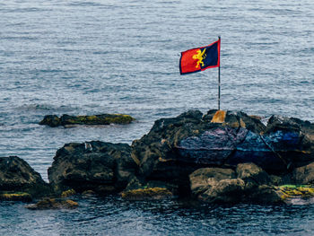 Scenic view of sea against rocks