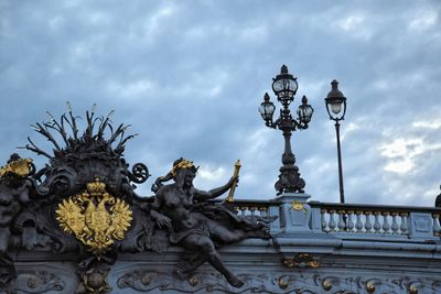 Low angle view of statue against sky