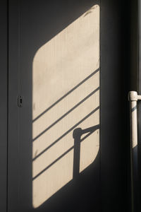 Low angle view of shadow on wall