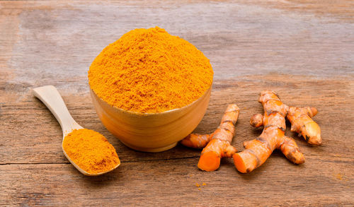 Turmeric with gingers on wooden table