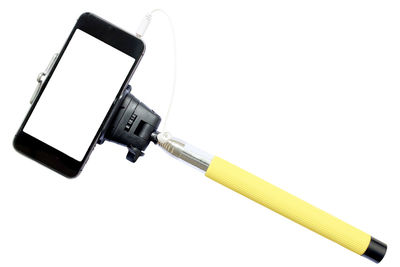 Close-up of mobile phone and tripod against white background