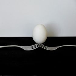 Close-up of apple on table against white background