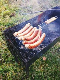 High angle view of meat on barbecue grill