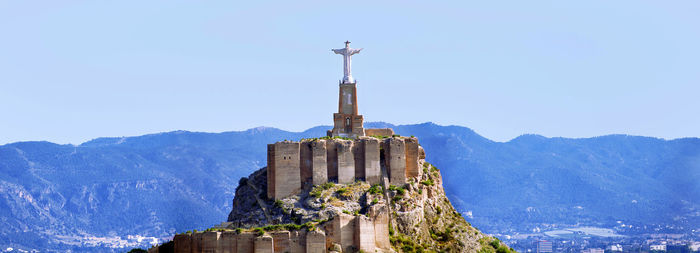 View of a building with mountain range in the background