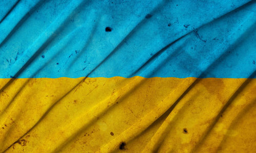 Old grunge vintage dirty weathered damaged national flag of ukraine, symbol of ukrainian patriotism