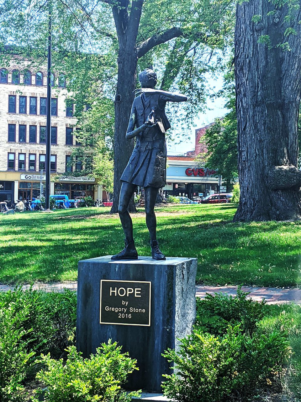 plant, tree, memorial, nature, statue, day, text, monument, grave, architecture, representation, park, green, grass, sculpture, communication, human representation, park - man made space, growth, outdoors, cemetery, no people, western script, built structure, tree trunk, trunk, male likeness, art